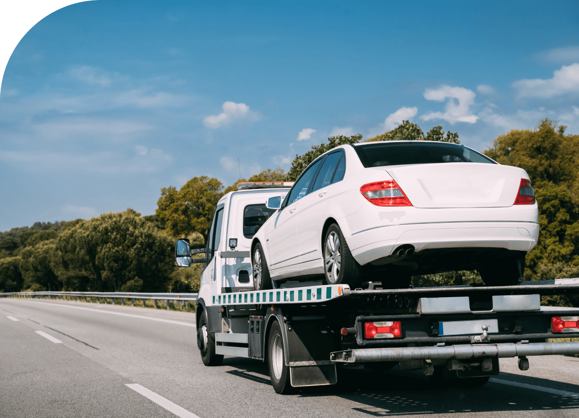 An image of a trucking hauling a car